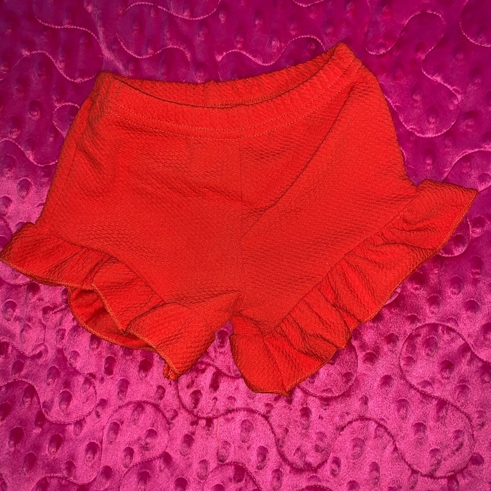 Orange ruffle shorts
